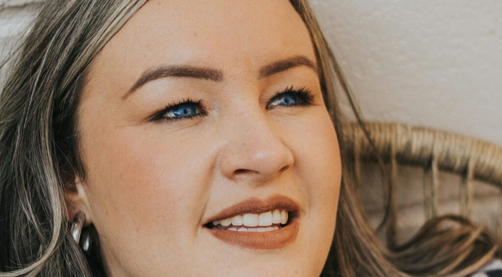 Close-up portrait of a young caucasian woman smiling in São Paulo, Brazil.